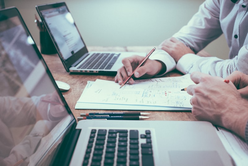 Financial advisor reviewing business documents and charts